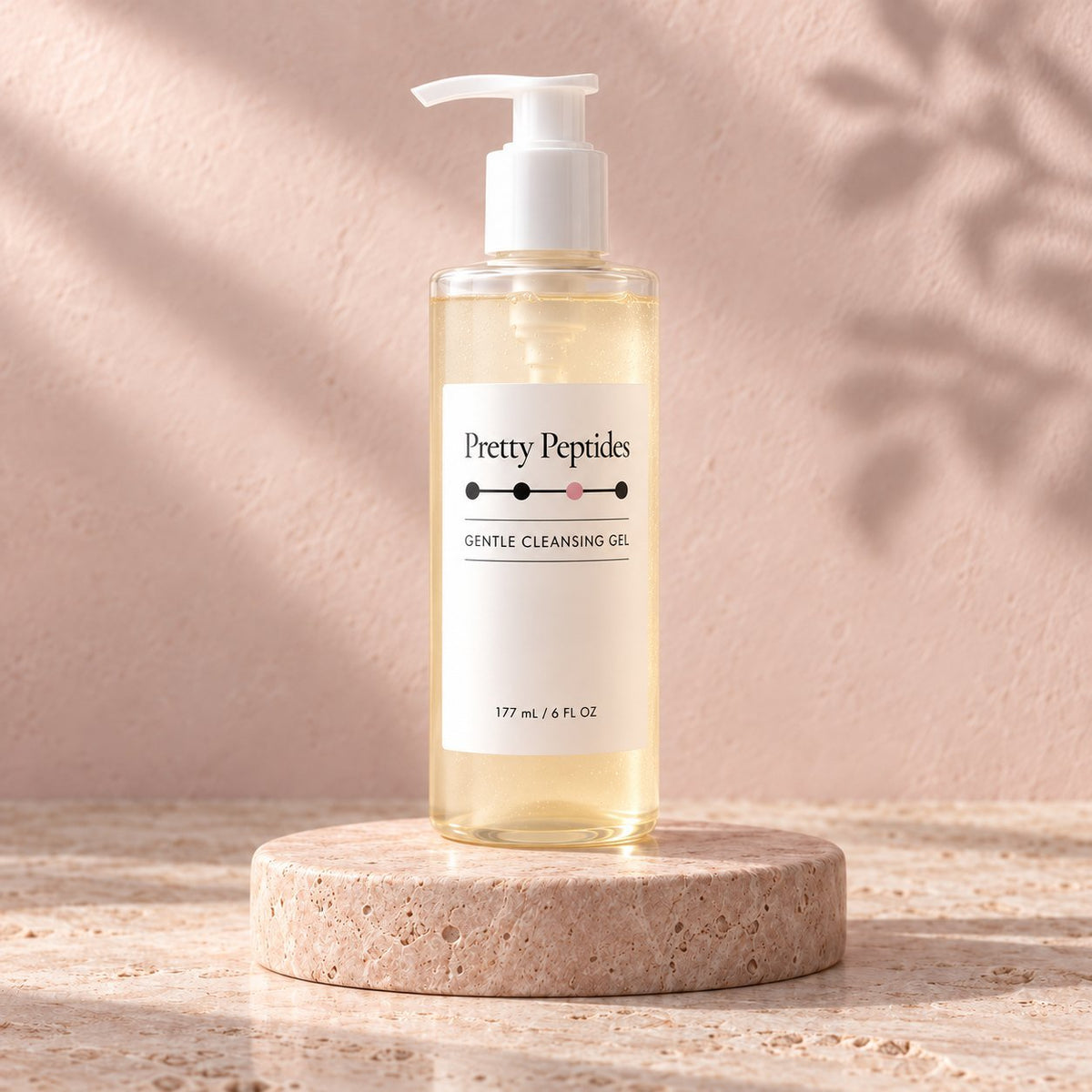 Pretty Peptides Gentle Cleansing Gel, 177 ml pump bottle on a travertine riser against a blush plaster wall