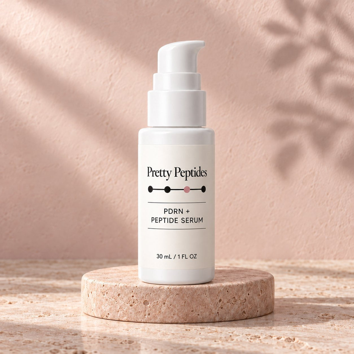 Pretty Peptides PDRN + Peptide Serum, 30 ml pump bottle on a travertine riser against a blush plaster wall