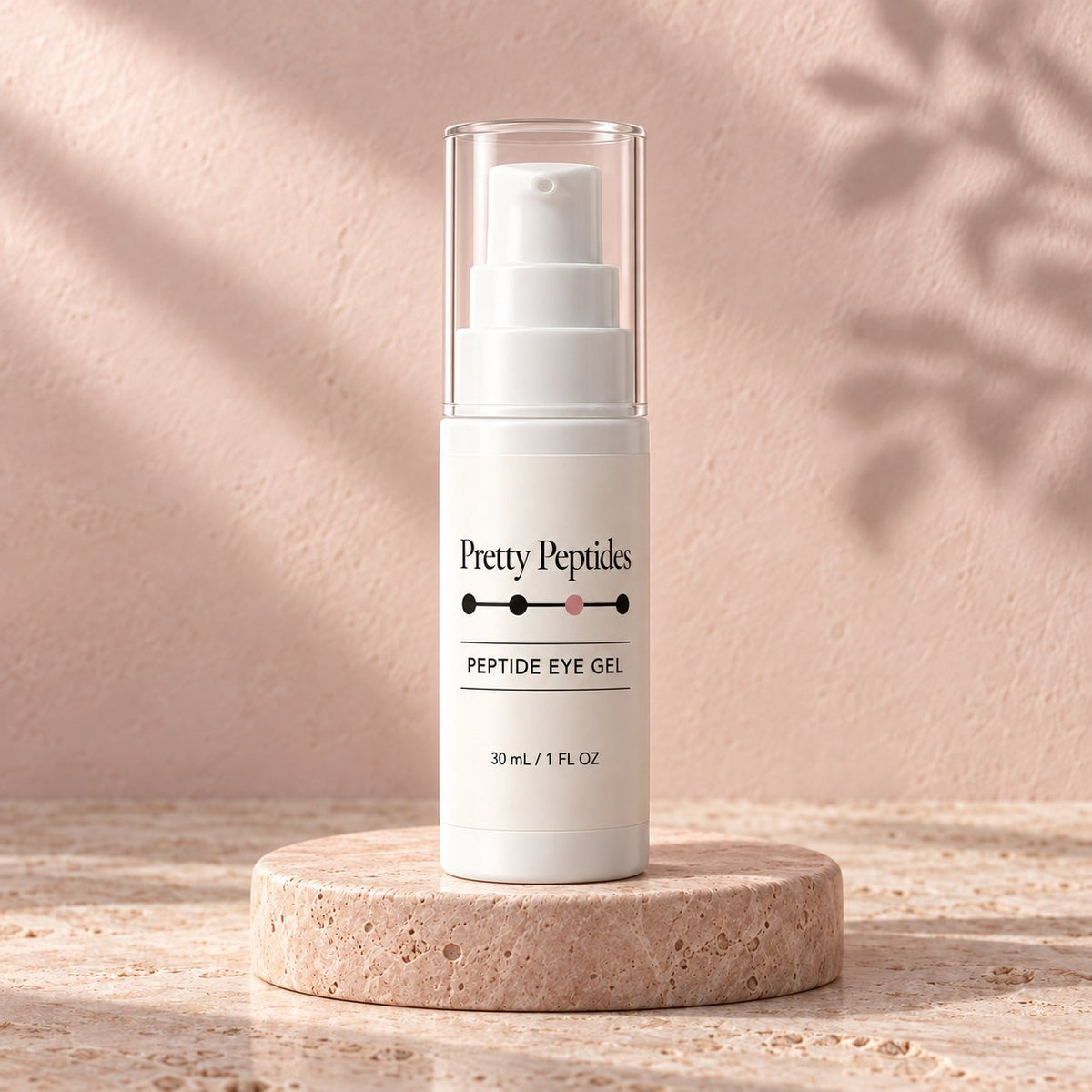 Pretty Peptides Peptide Eye Gel, 30 ml pump bottle on a travertine riser against a blush plaster wall
