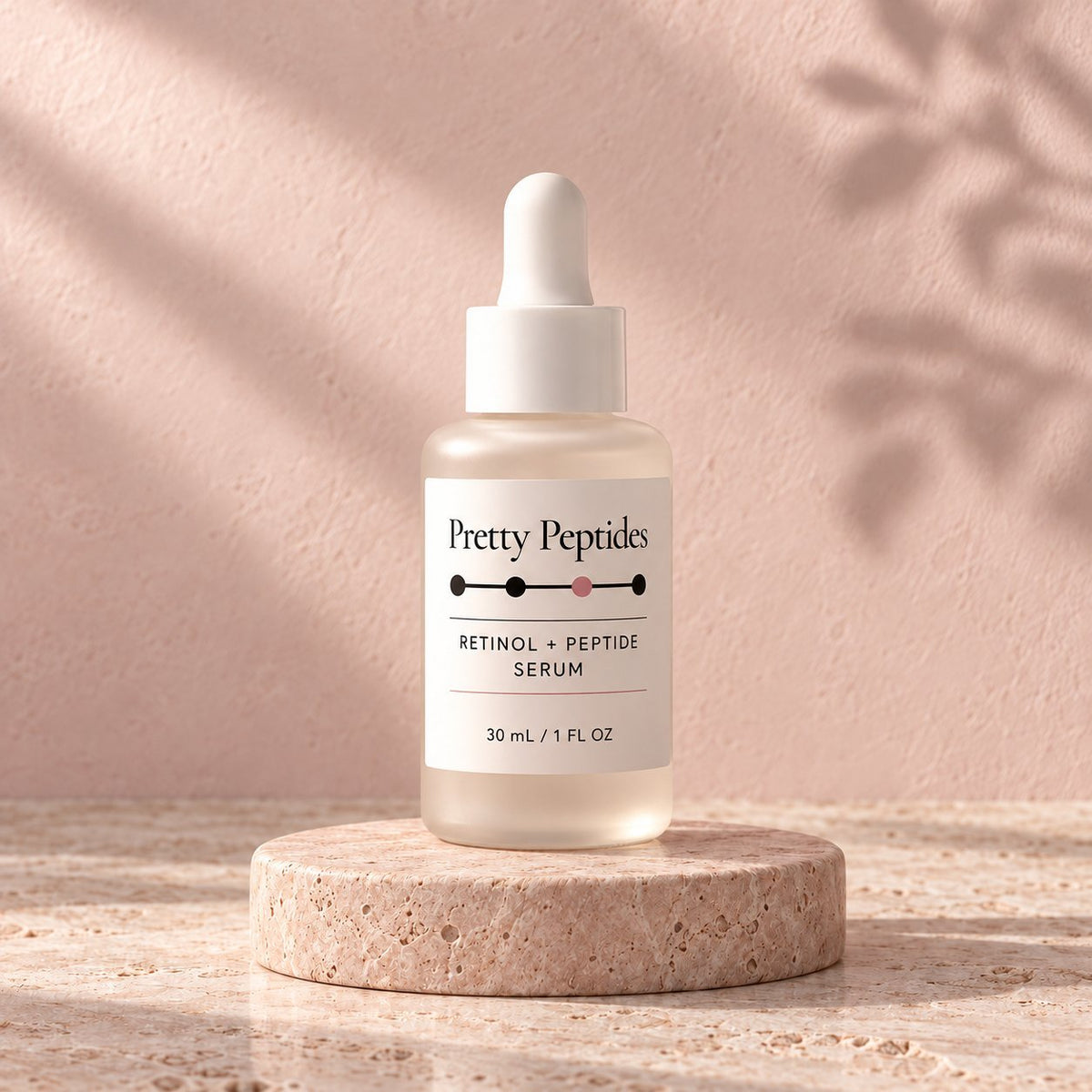 Pretty Peptides Retinol + Peptide Serum, 30 ml frosted dropper bottle on a travertine riser against a blush plaster wall